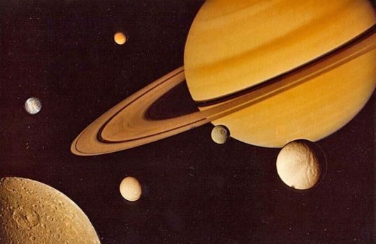 The planet Saturn, ringed by six moons