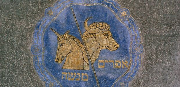 A mosaic showing the heads of horned animals