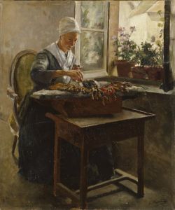 A person wearing a white cap, grey dress and glasses is seated by an open window, with plans on the windowsill, weaving lace