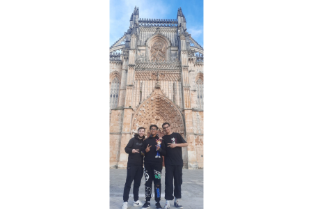 Students who are participating in the project, Vasco, Thiago, and Pedro in front of the Monastery
