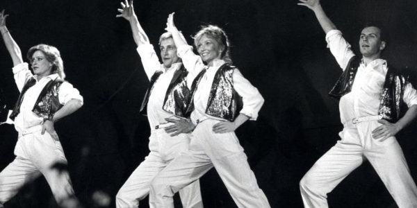 A group of dancers pose while performing