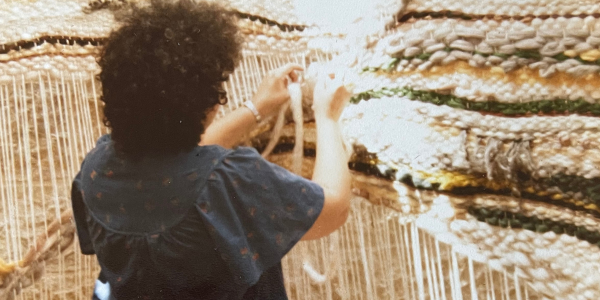 Susan Hazan weaving on a loom