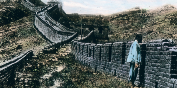 A man looks over the Great Wall of China