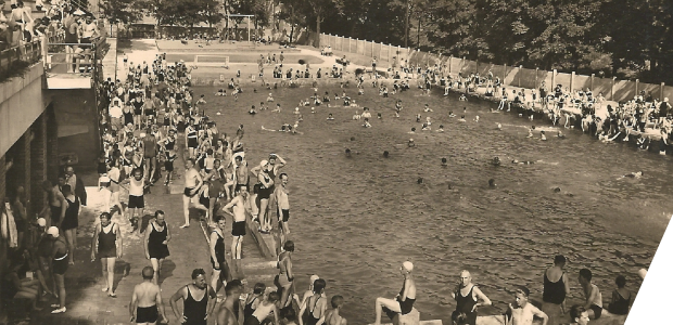 Pool of the lido in Balokány parkland in Pécs, full of swimmers.