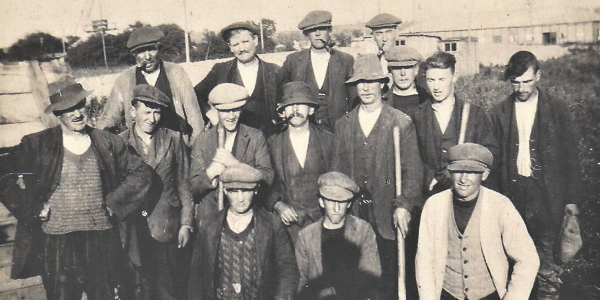 A group of workers gathered for a photograph
