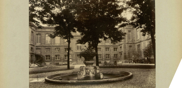 A fountain and trees in a square