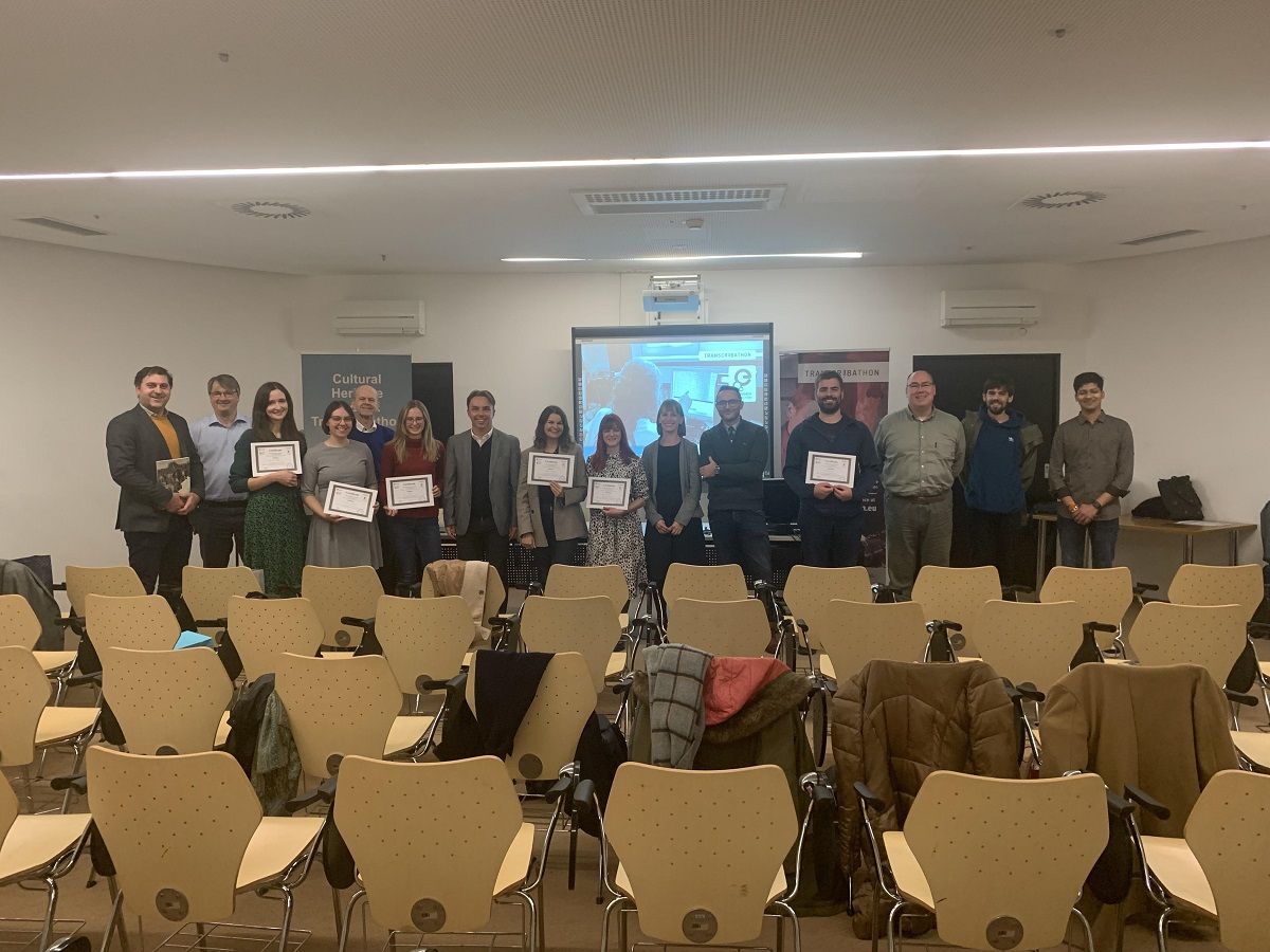 A photograph of Transcribathon participants holding up their certificates