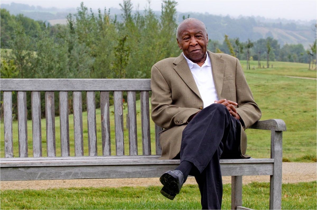 Dr Jefferson Wiggins sat on a park bench