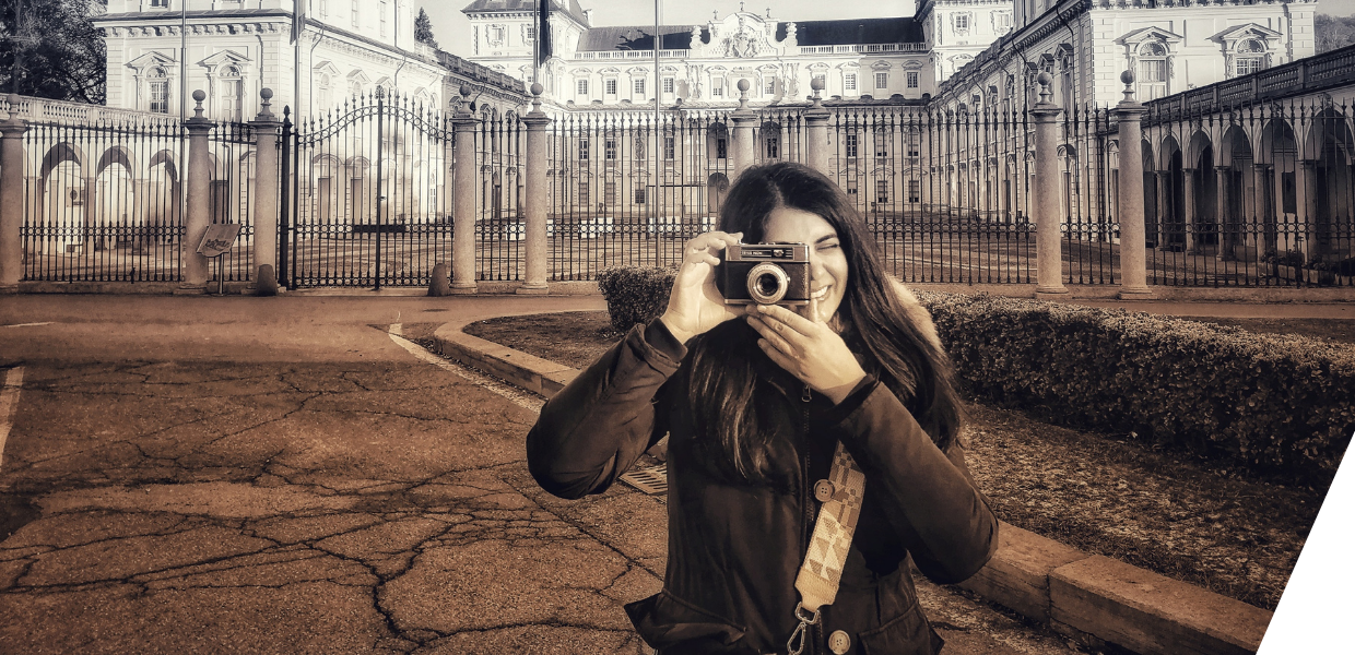 A photo of Francesca Condorelli taking a picture with a camera