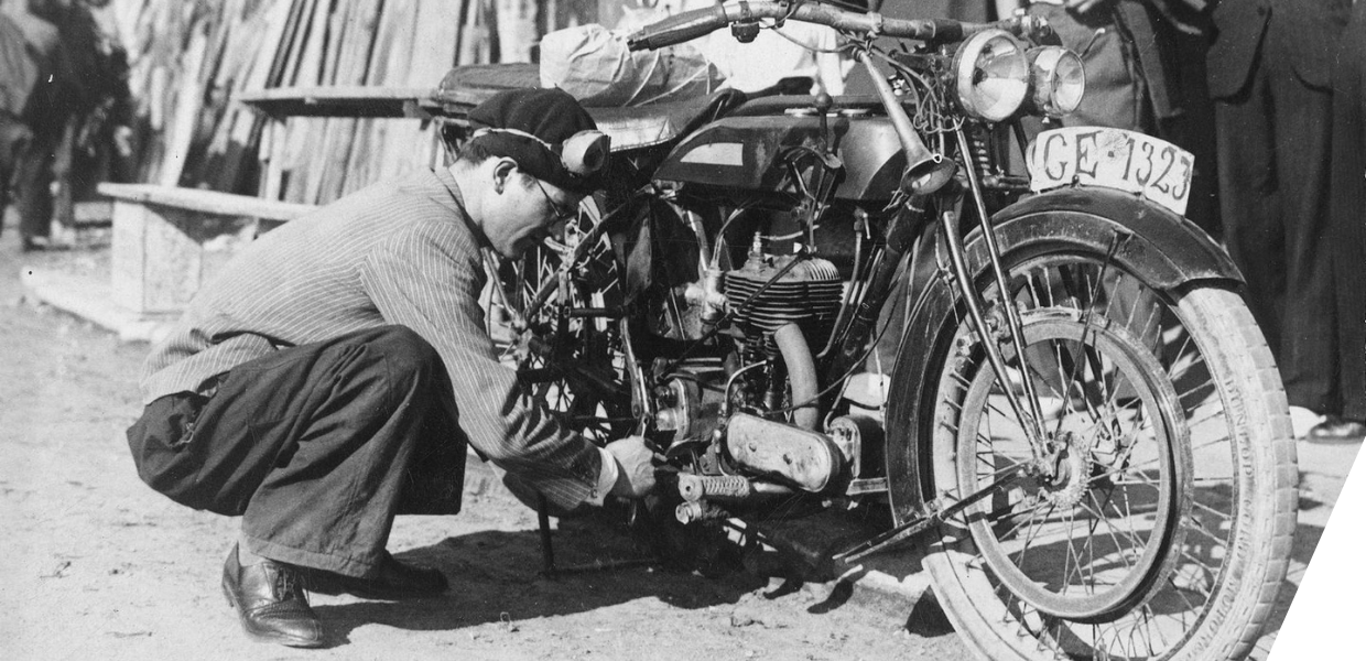 Henry Bartrina repairing his motorcycle