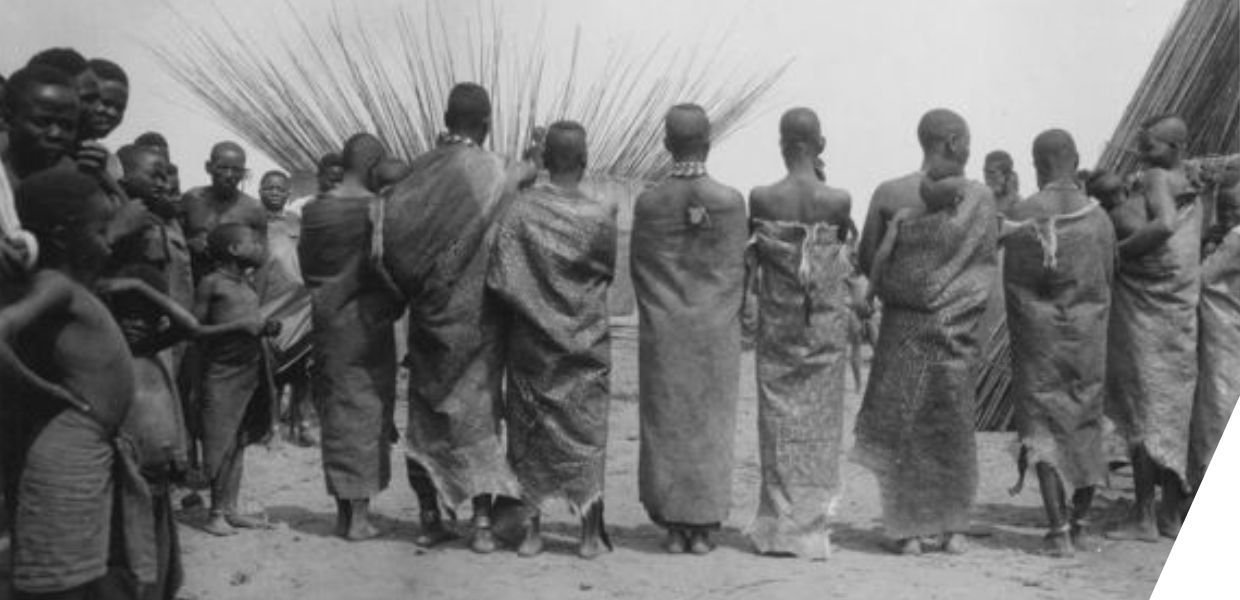 Photograph of women standing mainly with their backs to the camera
