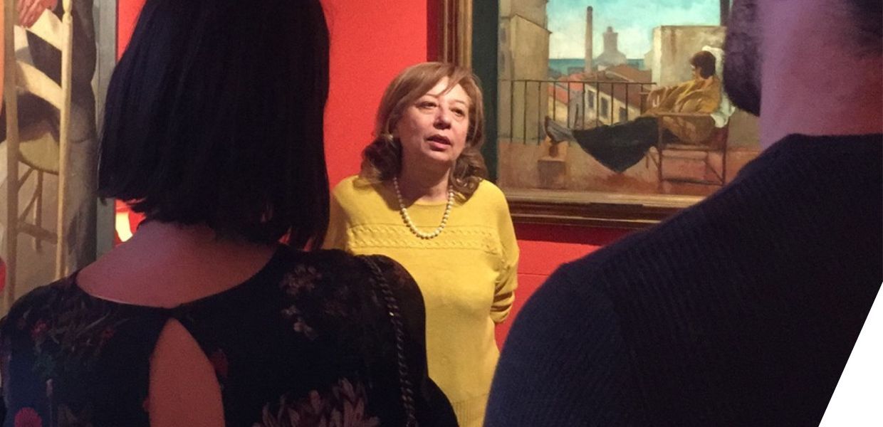 Vincenza Ferrara stood in a gallery speaking with students