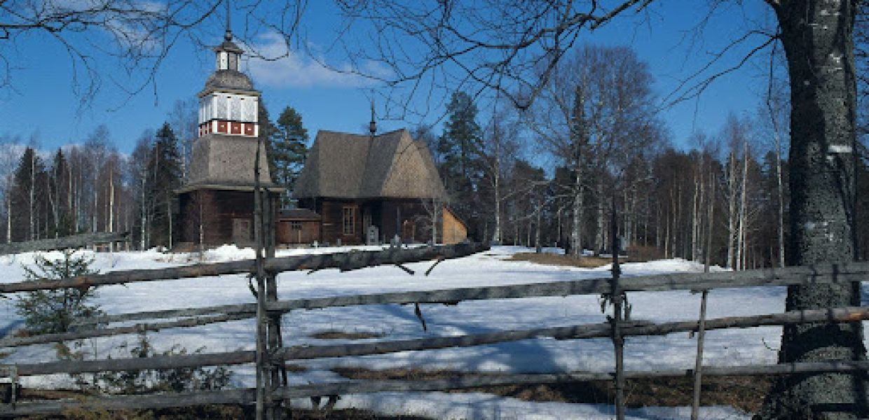 The Petäjävesi Old Church and a fence encircling its perimeter
