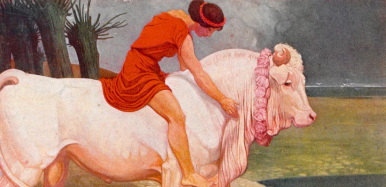 A woman riding a bull