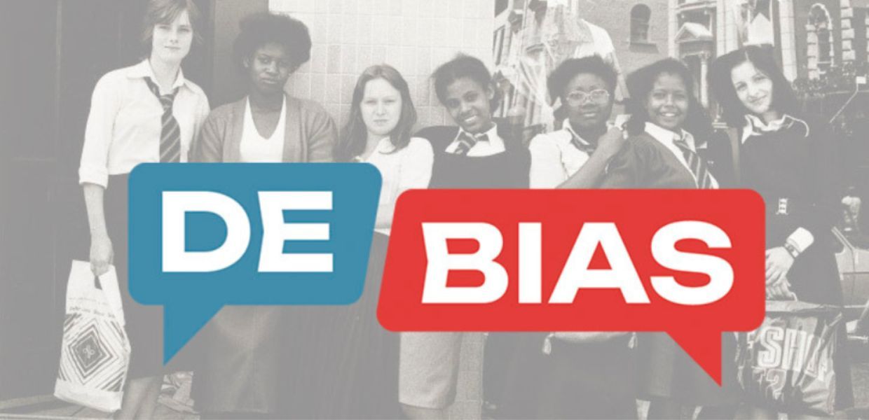 Schoolgirls stood in a line with the words DE BIAS overlaid